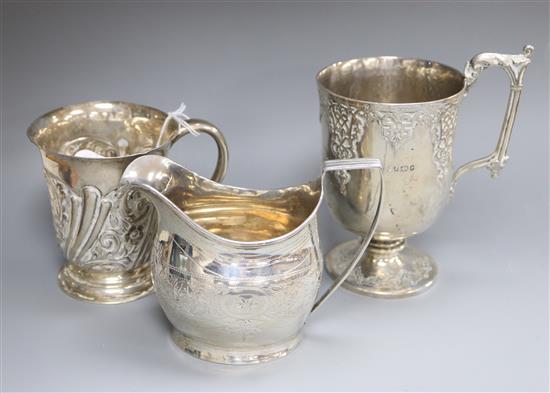 A George III silver cream jug, London, 1804 and two later silver christening mugs including Victorian.